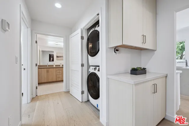 a view of a kitchen with washer and dryer