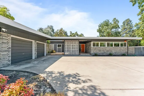 front view of a house with a yard