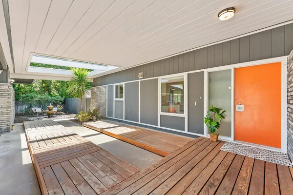 a view of backyard with a patio and wooden floor