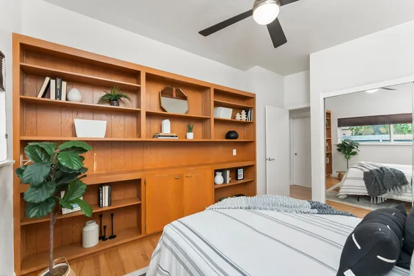 a bedroom with a bed and a cabinets