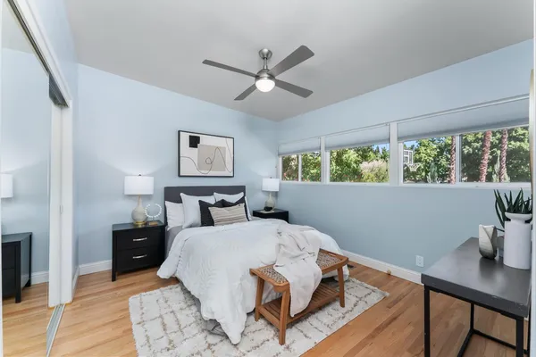 a bed room with a bed and a window
