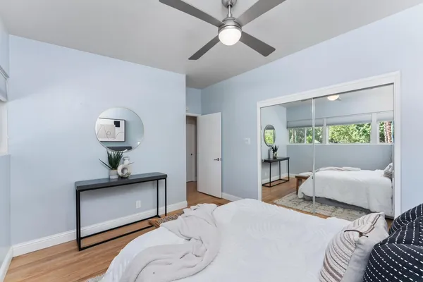 a bedroom with furniture and a window