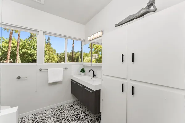 a bathroom with a sink and a mirror