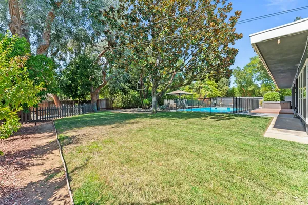 a view of backyard with green space