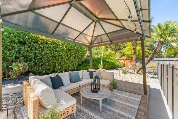 a patio with a yard table and chairs