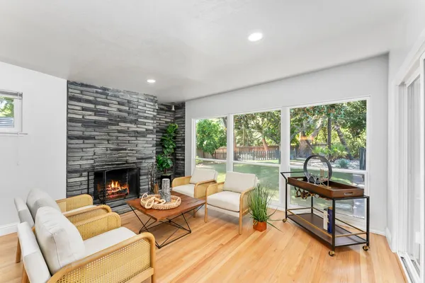 a living room with furniture and a fireplace