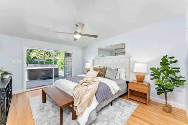 a bedroom with a bed and a couch