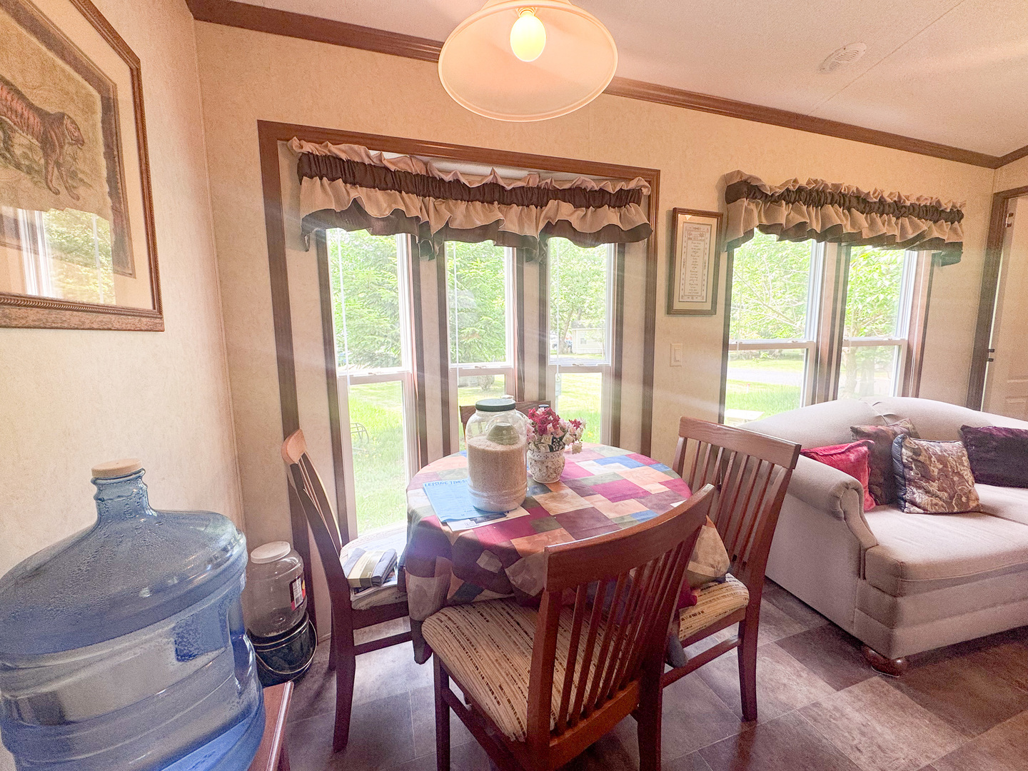 7-98 Woodhaven Sublette, IL 61367 - Photo 16 of 23 a view of a dining room with furniture large windows and wooden floor