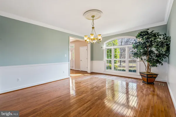 a kitchen with stainless steel appliances granite countertop a sink and dishwasher wooden cabinets with granite countertops