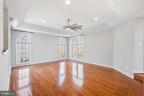a bath tub sitting in a bathroom next to a window