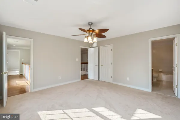 a front view of a house with sitting area and garden