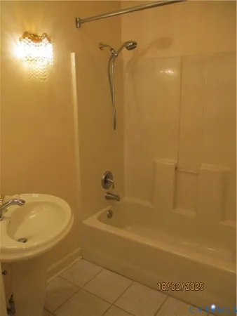 a bathroom with a tub and a shower