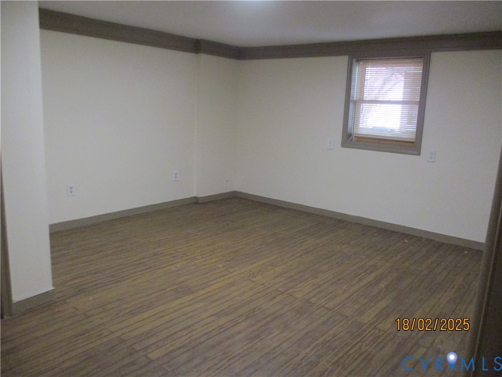 126 Beverly Road Ashland, VA 23005 - Photo 14 of 20 an empty room with wooden floor and windows
