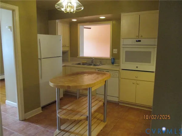 a bathroom with a sink a mirror and a shower