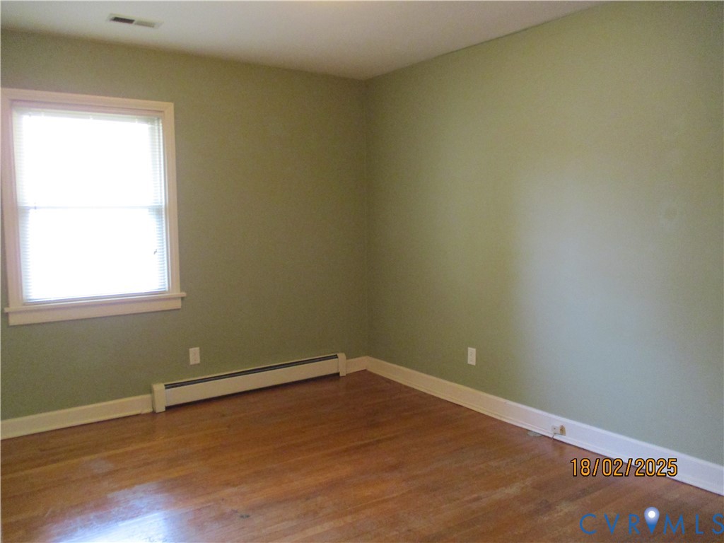 126 Beverly Road Ashland, VA 23005 - Photo 10 of 20 a view of a room with a wooden floor and a window