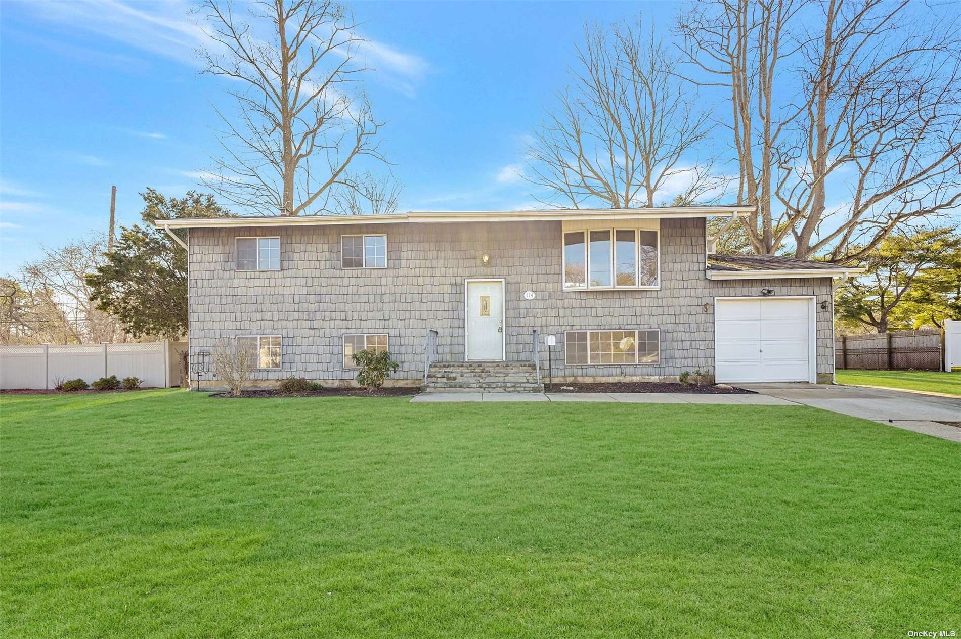 114 Ridge Road Wheatley Heights, NY 11798 - Photo 1 of 1 a view of a house with a yard
