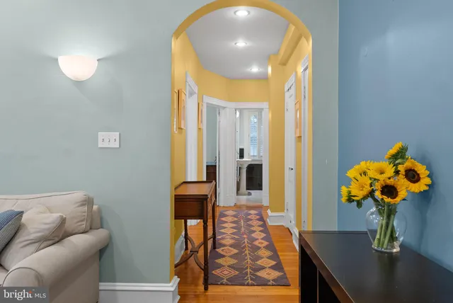 a dining room filled with furniture and wooden floor