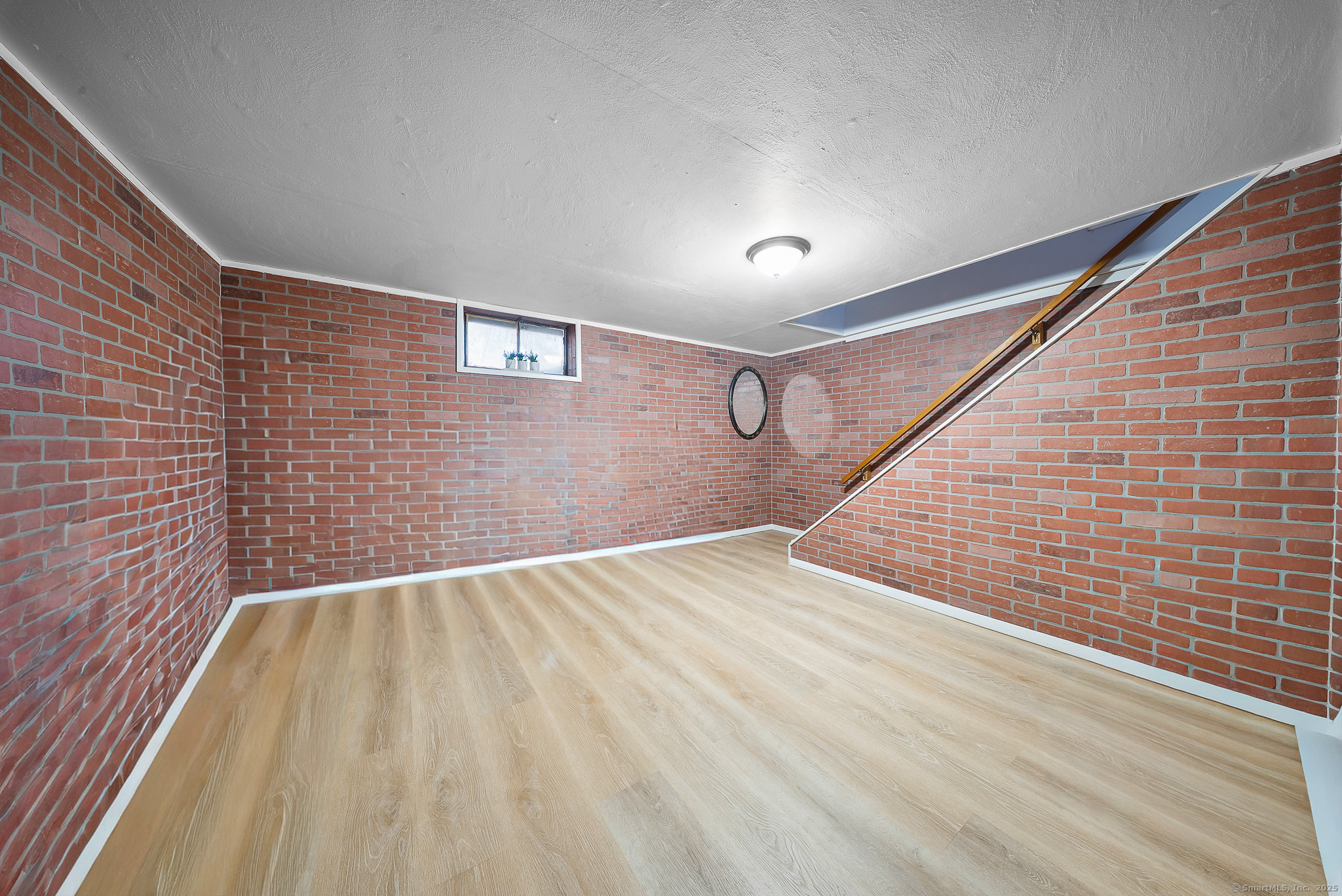 274 Sylvan Knoll Road Stamford, CT 06902 - Photo 11 of 21 a view of empty room with wooden floor