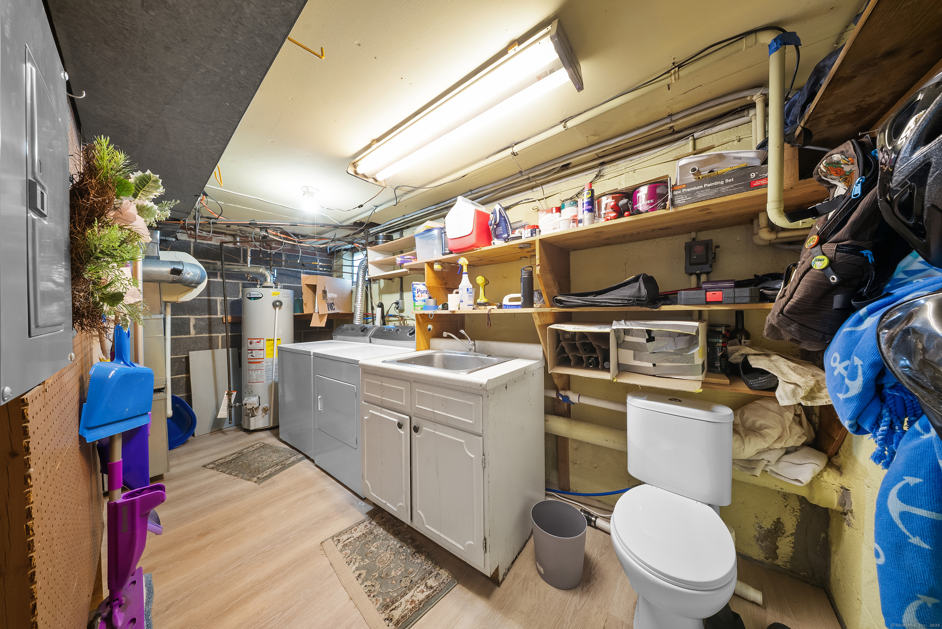 274 Sylvan Knoll Road Stamford, CT 06902 - Photo 12 of 21 a utility room with dryer washer and a view of living room