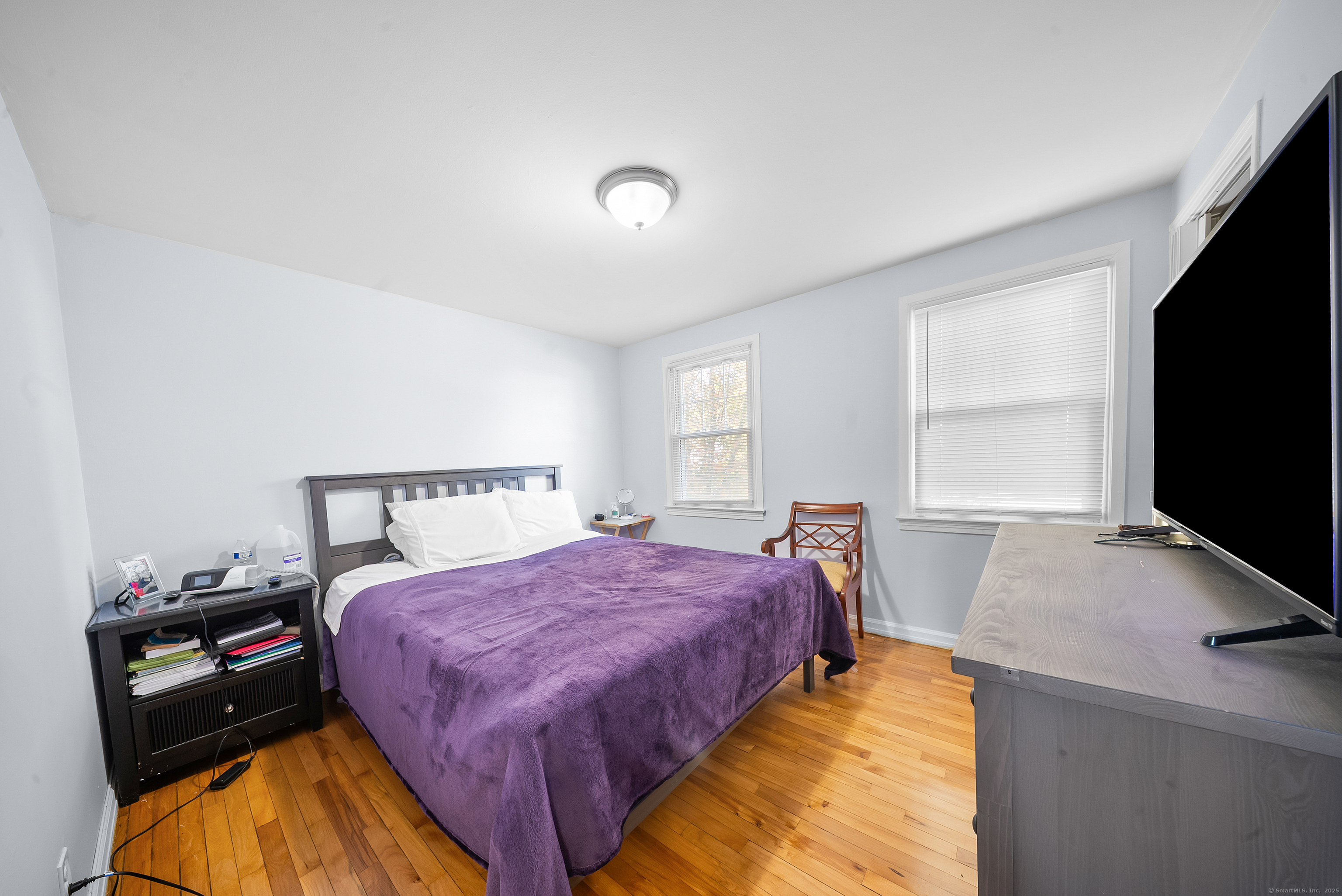 274 Sylvan Knoll Road Stamford, CT 06902 - Photo 4 of 21 a bedroom with a bed and a flat screen tv