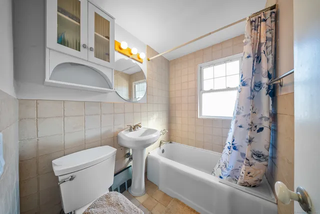 a bathroom with a sink a toilet and a bathtub