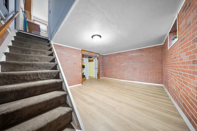 a view of an empty room with stairs