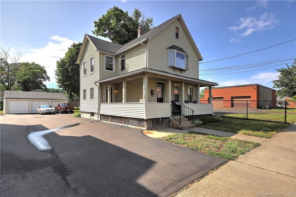 58 Washington Street Wallingford, CT 06492 - Photo 1 of 1 a front view of a house with a yard