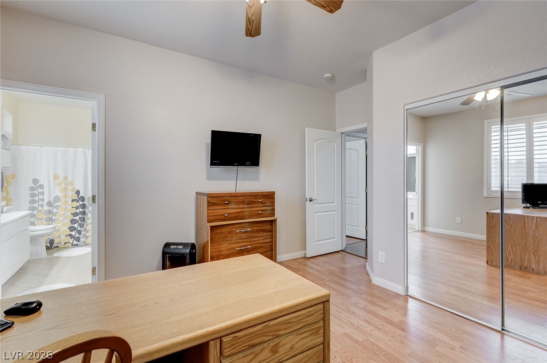 1604 Cattle Ranch Place Henderson, NV 89002 - Photo 57 of 99 Well-lit interior space with hardwood flooring and convenient bathroom access.