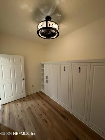 a view of a hallway with a chandelier
