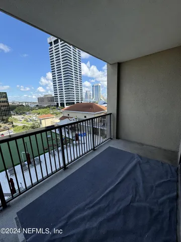 a view of balcony with furniture