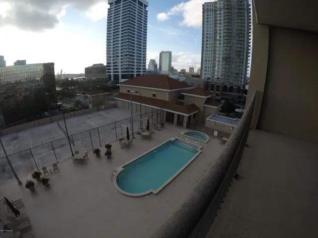 an aerial view of a house with outdoor space