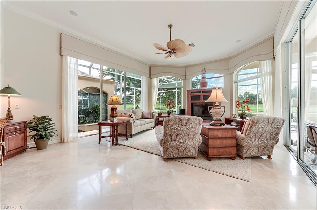 10200 Orchid Ridge Lane Estero, FL 34135 - Photo 16 of 50 a living room with furniture and a large window