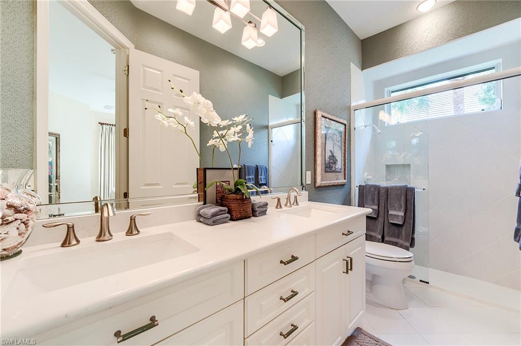 10200 Orchid Ridge Lane Estero, FL 34135 - Photo 24 of 50 a bathroom with a double vanity sink mirror and toilet