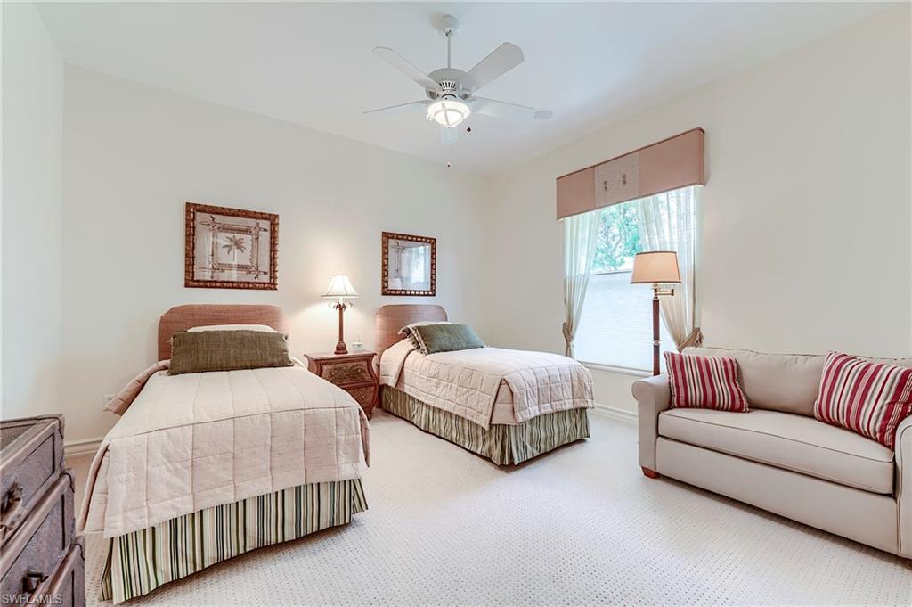 10200 Orchid Ridge Lane Estero, FL 34135 - Photo 25 of 50 a bedroom with two beds and a couch
