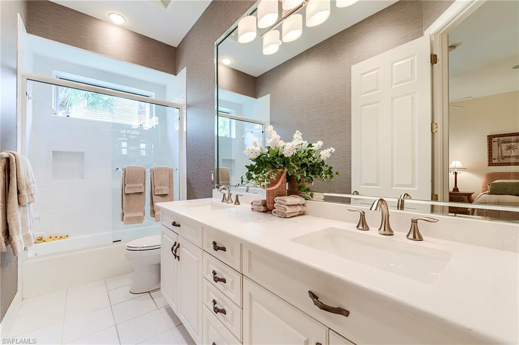 10200 Orchid Ridge Lane Estero, FL 34135 - Photo 27 of 50 a bathroom with a double vanity sink mirror and toilet