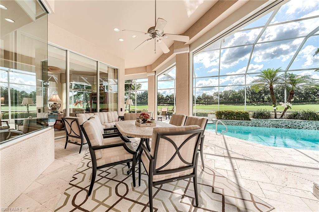 10200 Orchid Ridge Lane Estero, FL 34135 - Photo 32 of 50 a view of a patio with dining table and chairs