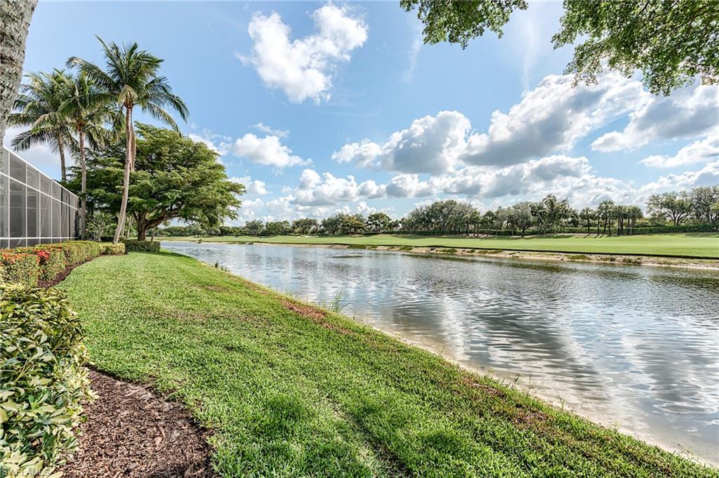 10200 Orchid Ridge Lane Estero, FL 34135 - Photo 34 of 50 a view of a lake with a big yard