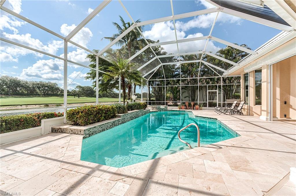 10200 Orchid Ridge Lane Estero, FL 34135 - Photo 4 of 50 a view of a backyard with a swimming pool