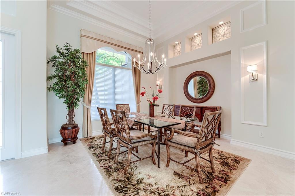10200 Orchid Ridge Lane Estero, FL 34135 - Photo 8 of 50 a view of a dining room with furniture and a large window