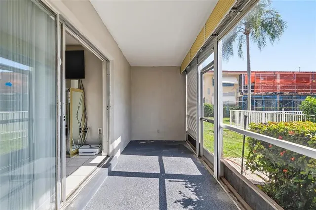 a view of balcony with a floor to ceiling window and wooden floor