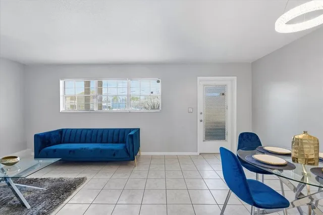 a living room with furniture and a window