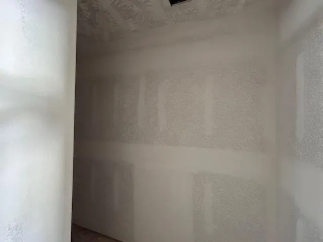 a close up of a white marble wall