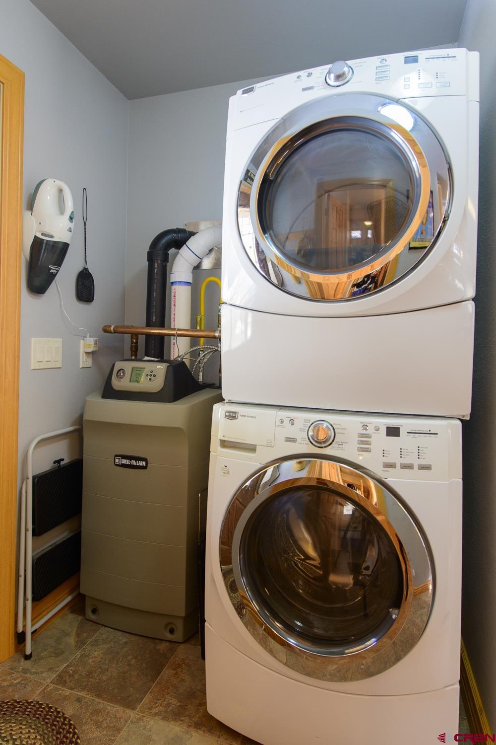 825-823 Main Street Pitkin, CO 81241 - Photo 14 of 42 a utility room with dryer and washer