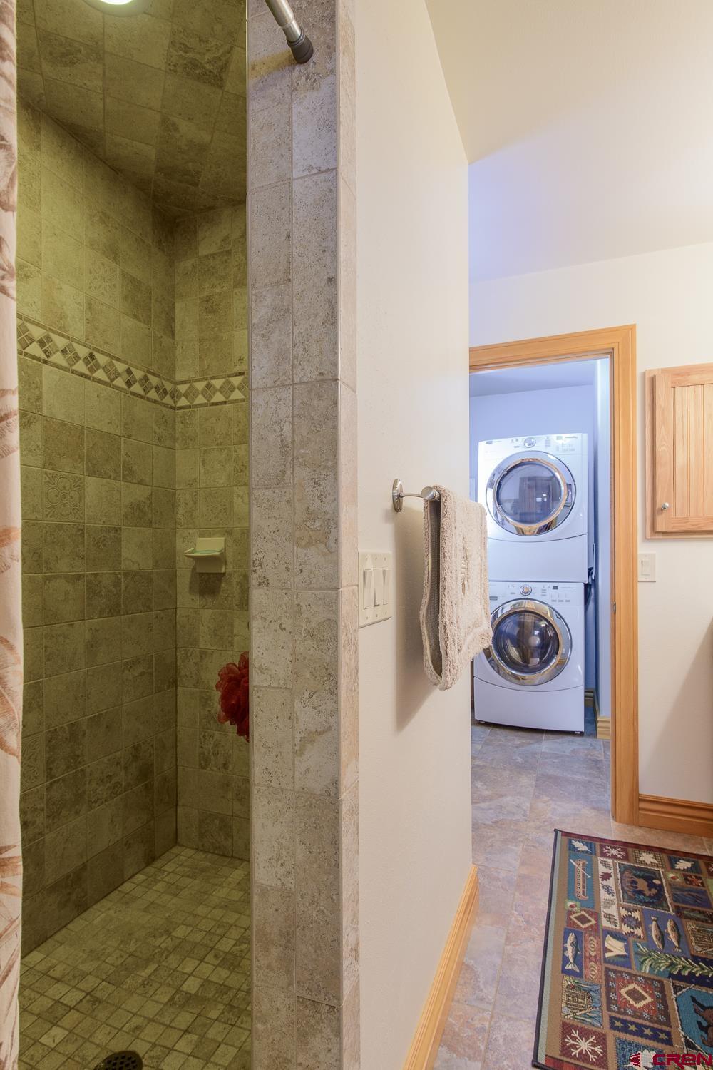 825-823 Main Street Pitkin, CO 81241 - Photo 18 of 42 a bathroom with a bathtub and shower