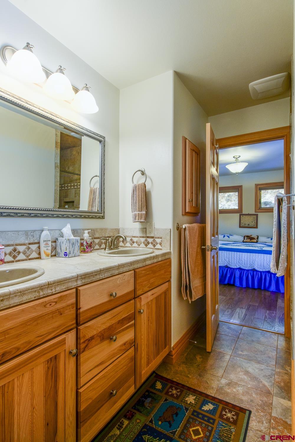825-823 Main Street Pitkin, CO 81241 - Photo 19 of 42 a bathroom with a sink and a mirror