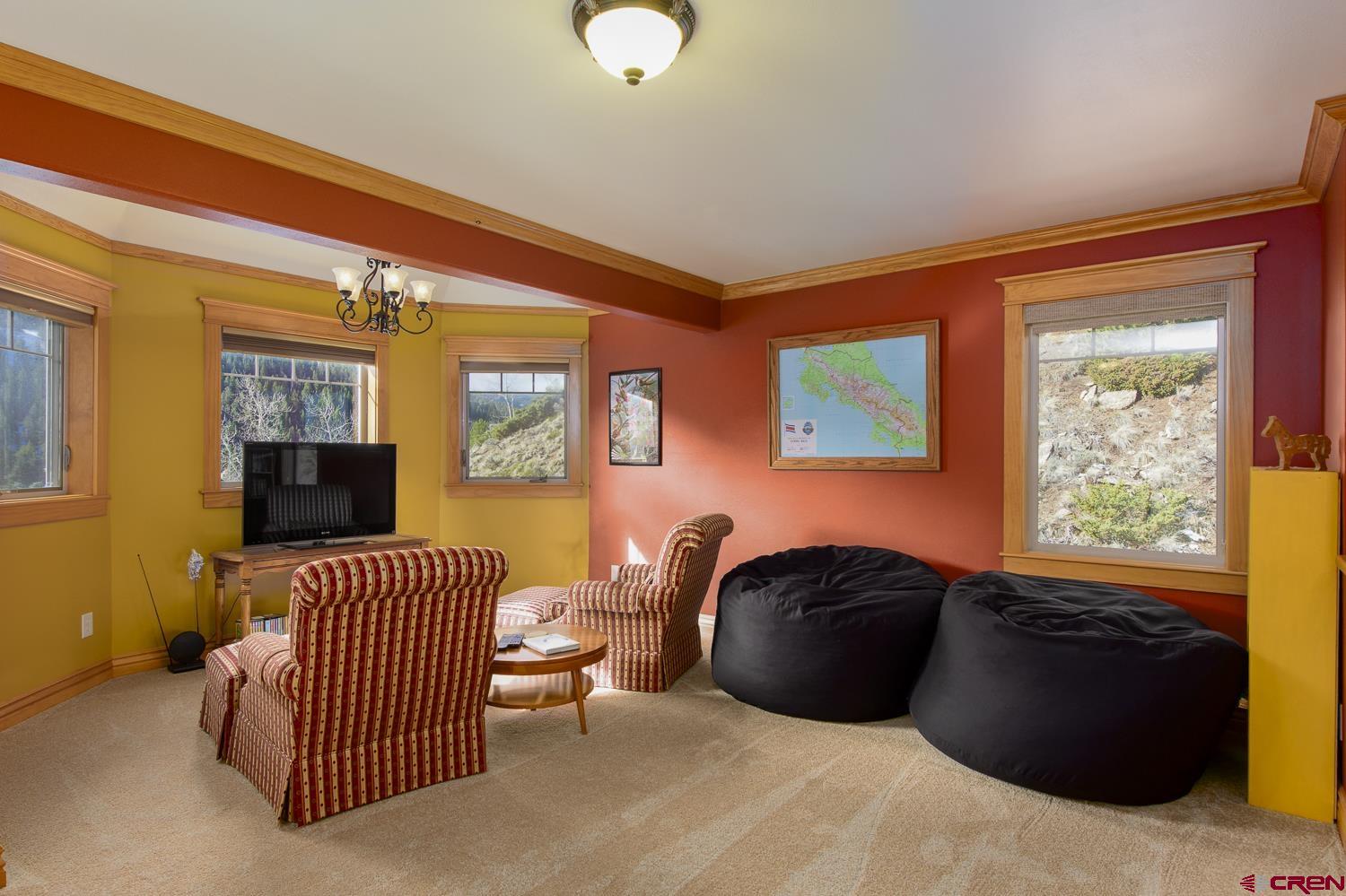 825-823 Main Street Pitkin, CO 81241 - Photo 20 of 42 a bedroom with a bed and wooden floor