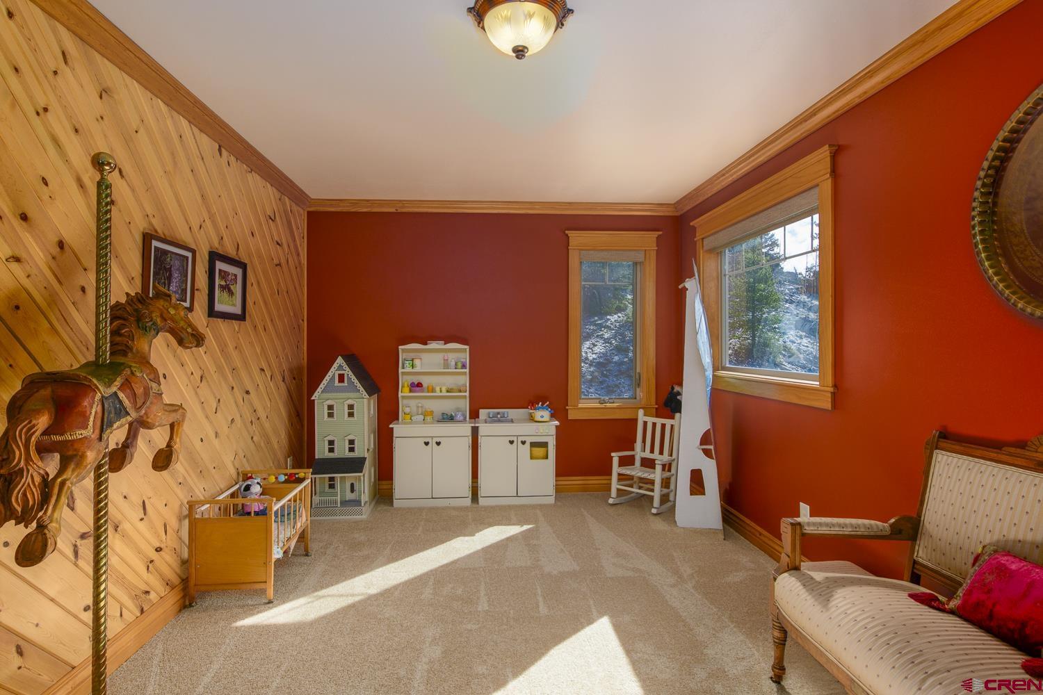 825-823 Main Street Pitkin, CO 81241 - Photo 22 of 42 a bedroom with furniture and a window