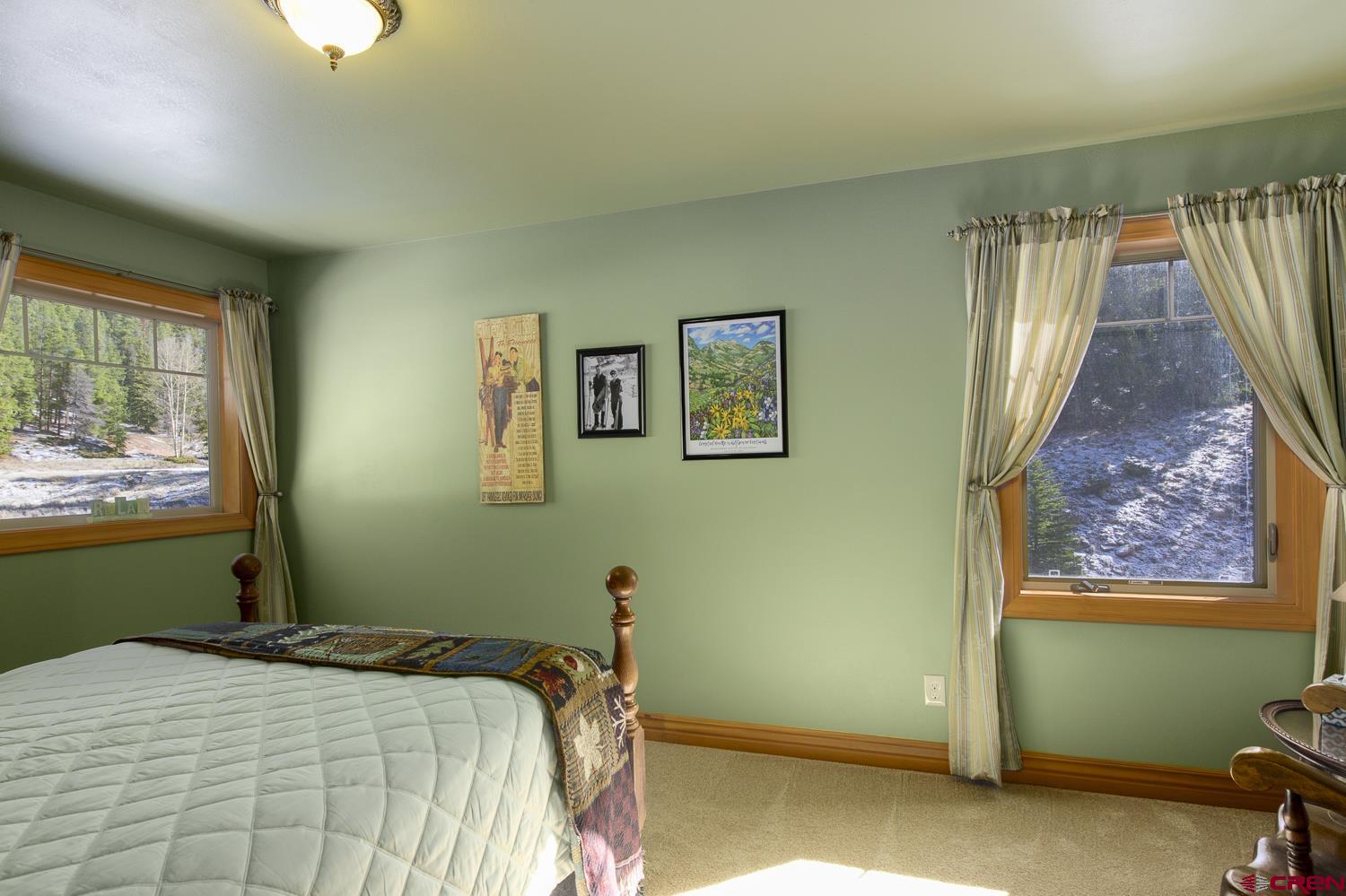 825-823 Main Street Pitkin, CO 81241 - Photo 24 of 42 a bedroom with a bed and a window