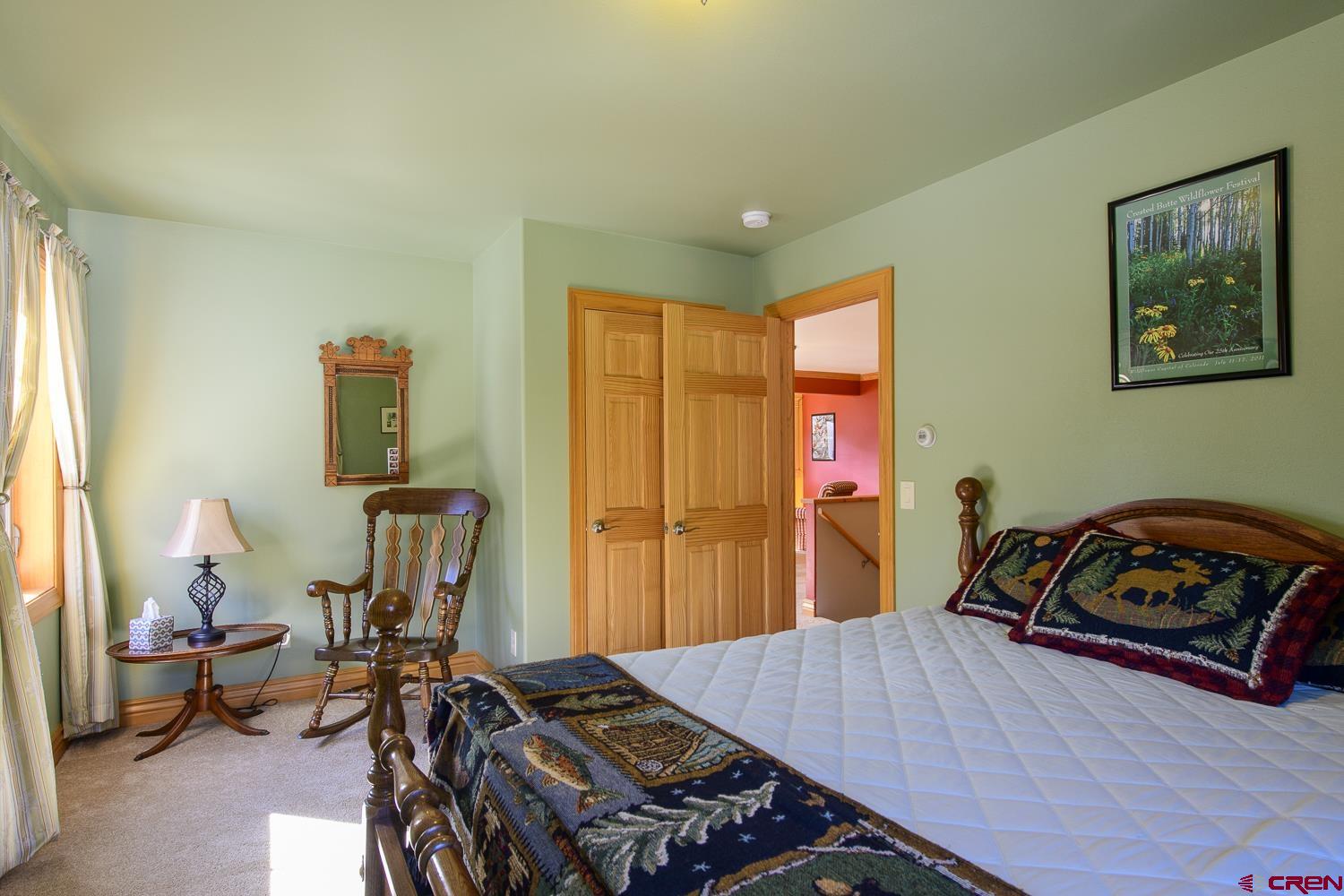 825-823 Main Street Pitkin, CO 81241 - Photo 26 of 42 a bedroom with furniture and a window