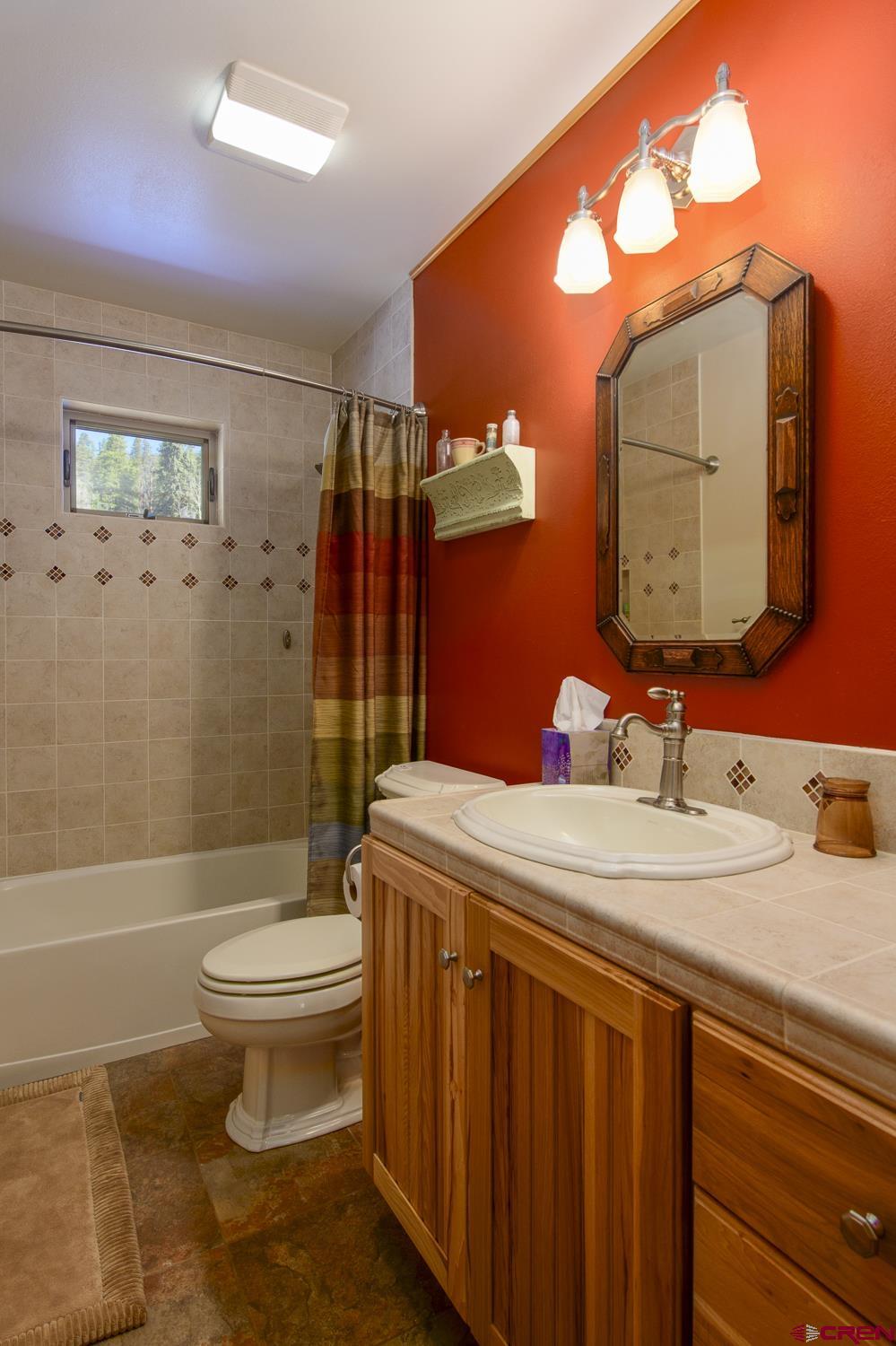825-823 Main Street Pitkin, CO 81241 - Photo 27 of 42 a bathroom with a sink toilet and shower